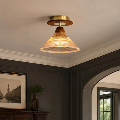 Vintage pleated ceiling light in a moody hallway interior