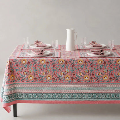 Pink garden border floral tablecloth on a dining table