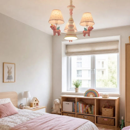 Pink chandelier in a nursery room setting