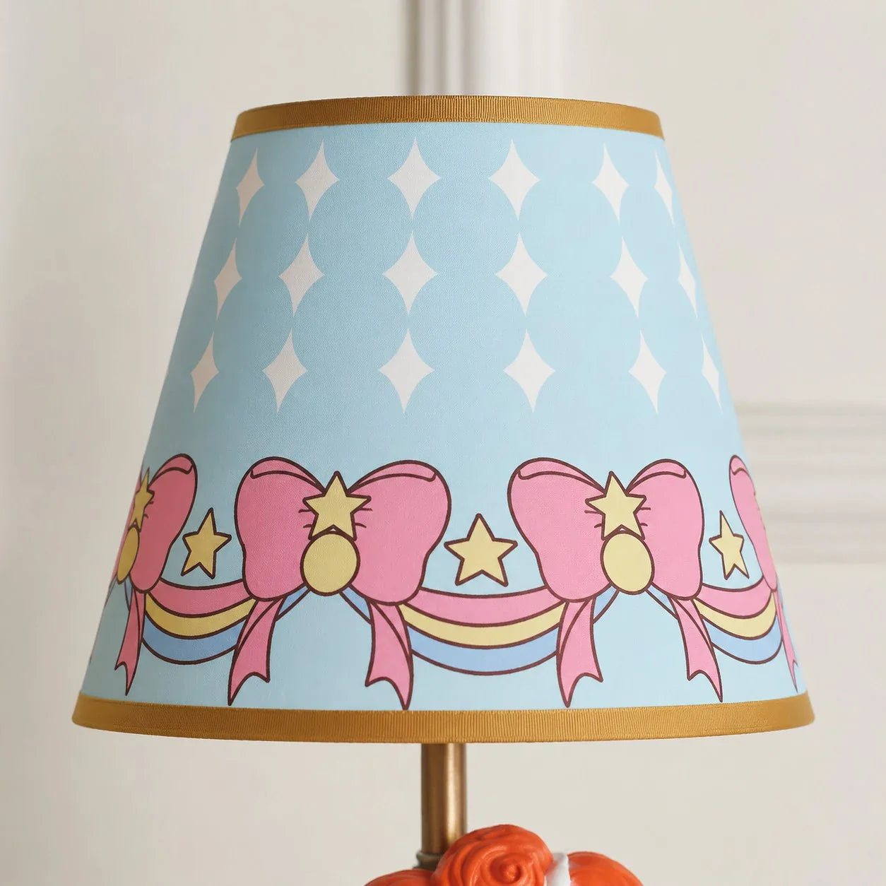 Blue printed fabric shade detail with bows and stars