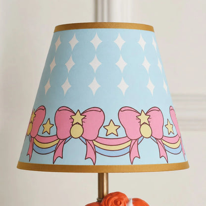 Blue printed fabric shade detail with bows and stars