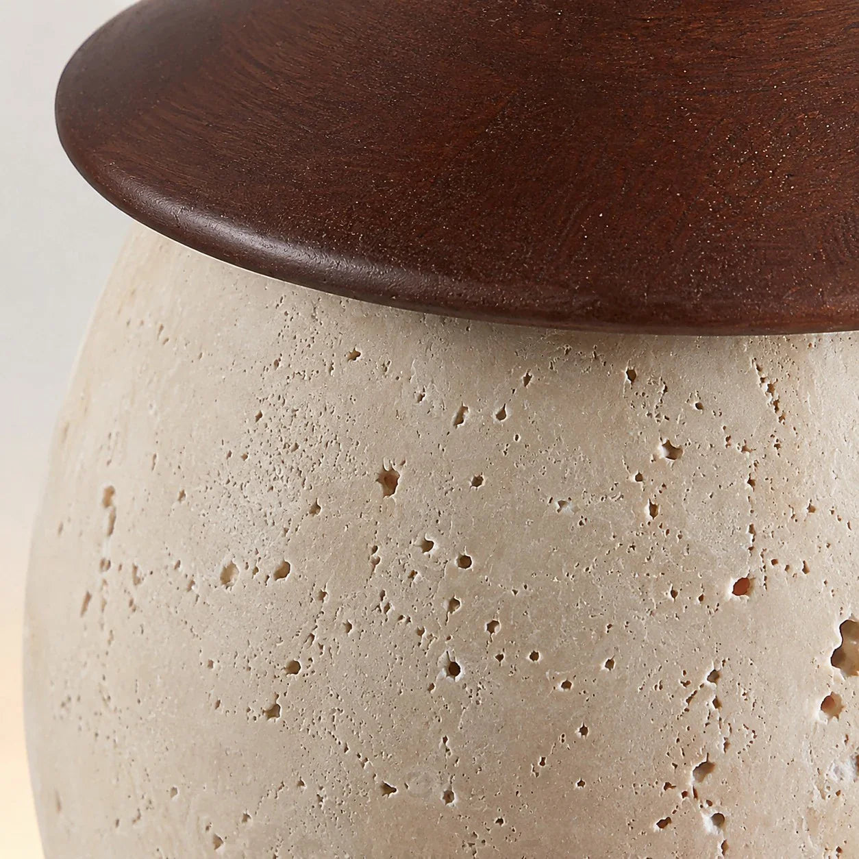 Stone texture and dark top fitting rim close-up