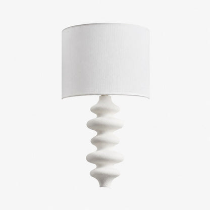 White sculptural wall lamp with white fabric shade