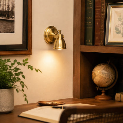 Brass wall lamp installed in a warm interior