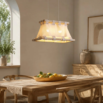 Pendant lamp scale above long dining table