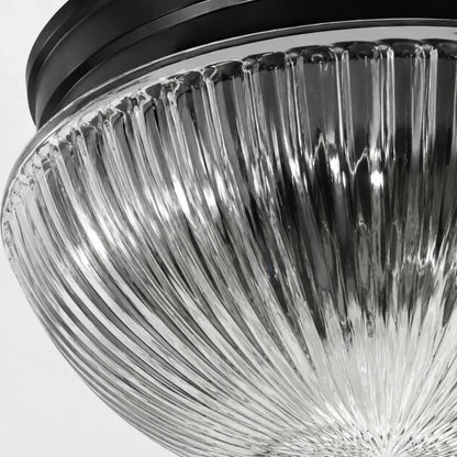 Close detail of ribbed clear glass texture and black canopy