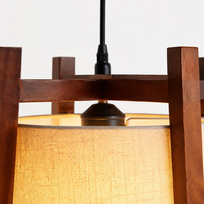 Close-up of walnut finish top frame and black cord