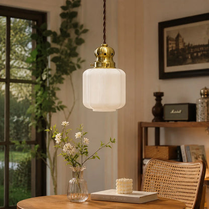 White glass pendant lamp in a cozy window corner