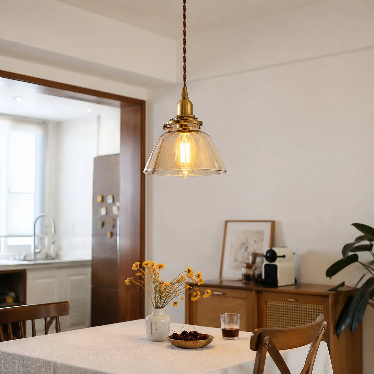 Amber glass pendant above a kitchen table