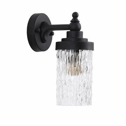 Black metal wall sconce with ribbed clear glass shade