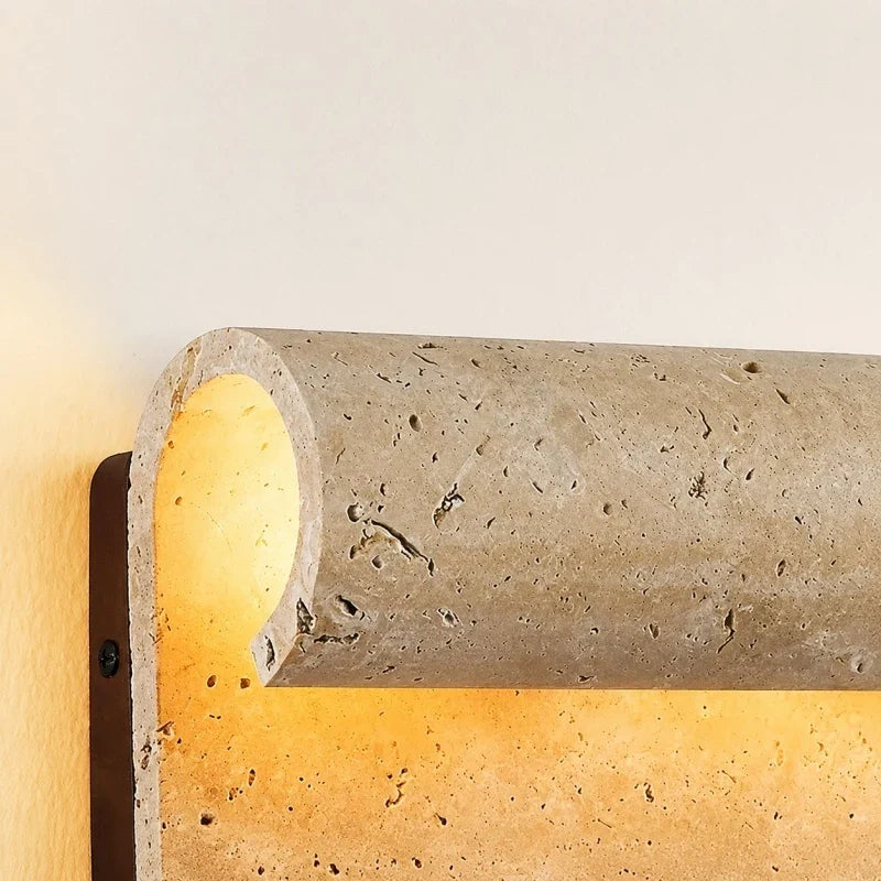 Rounded travertine wall light detail
