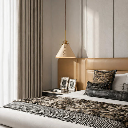 Leather pendant light in a warm bedroom setting