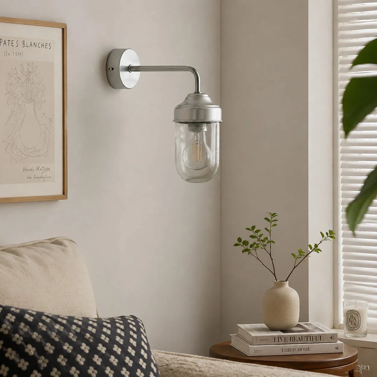 Aluminum glass wall sconce in a calm interior corner
