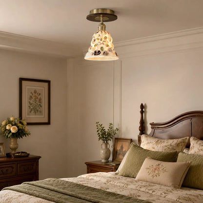 Shell glass ceiling light in a calm bedroom scene