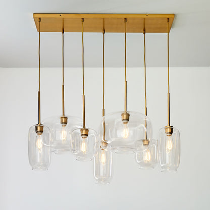 Lumivelle Sculptural 7-Light Chandelier – Adjustable Height Modern Glass Pendant