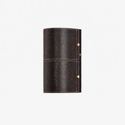 Dark brown leather wrapped wall sconce on clean background