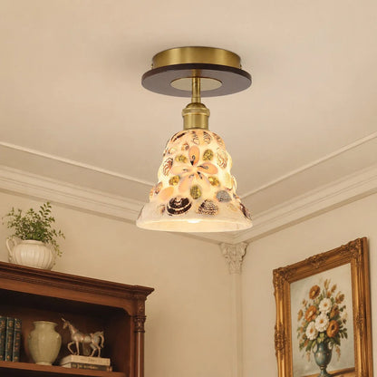 Shell glass ceiling light in a compact entryway scene