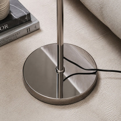 Polished chrome floor lamp base and stem detail