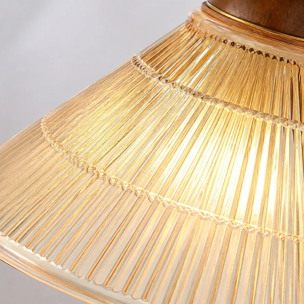 Lit amber pleated shade texture detail