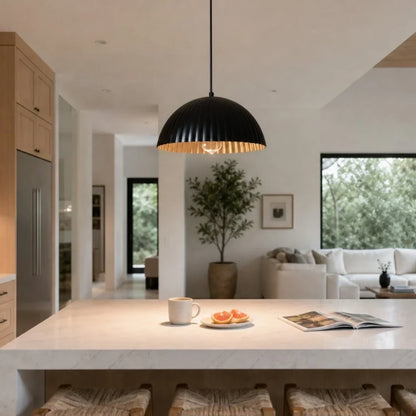 Black metal pendant lamp in an open kitchen and living space