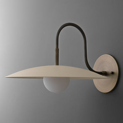 Curva Metal Modern Wall Sconce - Antique Brass Arm with Cream Disc Shade