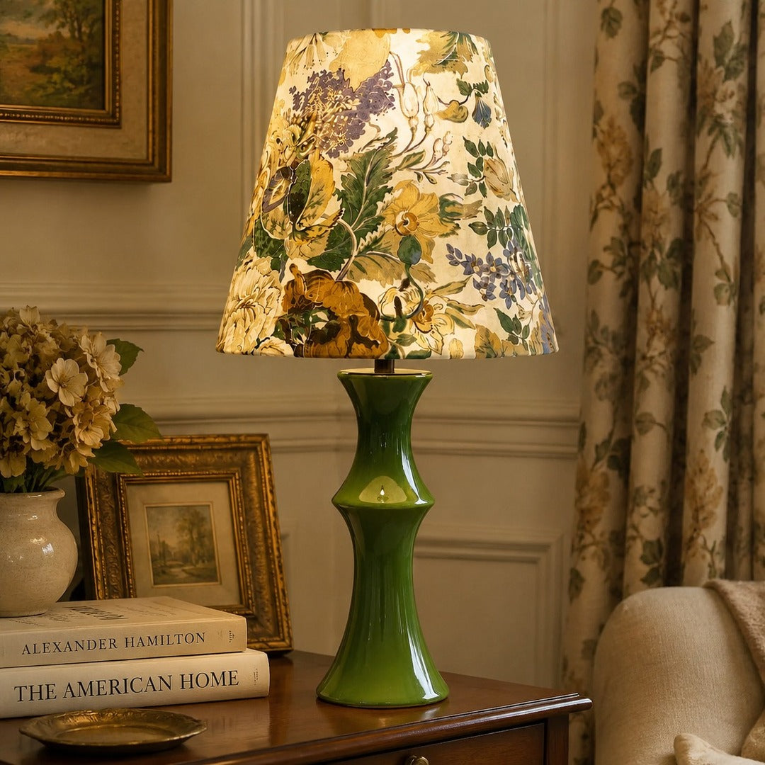 Beige floral table lamp in a classic bedside setting
