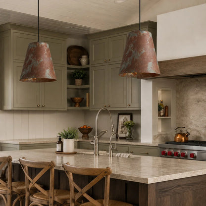 Vintage patina pendant lamps in a warm dining kitchen space