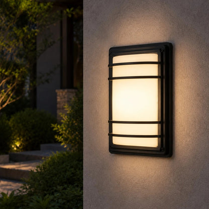 Outdoor wall light installed on an exterior wall at night