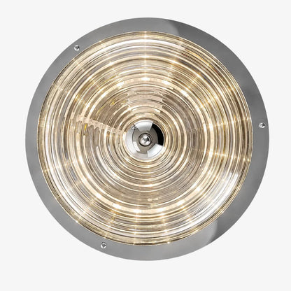 Bottom view of concentric rippled glass pattern with warm light