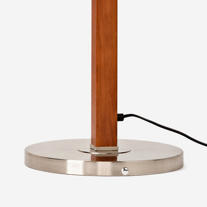 Round metal base and wood-tone pole detail
